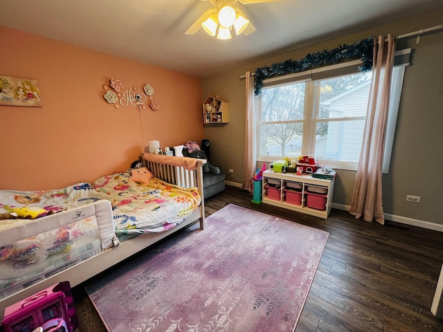 bedroom with wood finished floors, baseboards, and ceiling fan