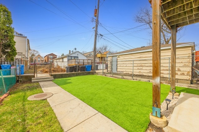 view of yard with fence and a residential view