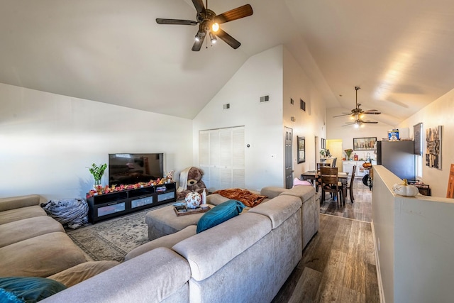 living room with high vaulted ceiling, ceiling fan, visible vents, and dark wood-style floors