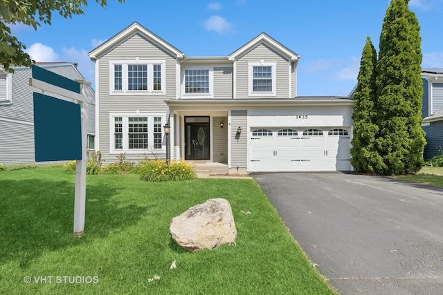 1635 Arlington Ln, Gurnee, IL 60031 - traditional-style home with asphalt driveway, a front yard, and a garage