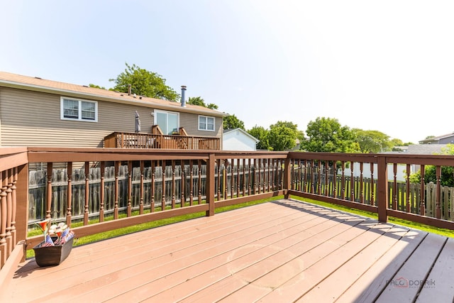 1680 Bicek Dr, Hoffman Estates, IL 60192 - wooden deck with a fenced backyard
