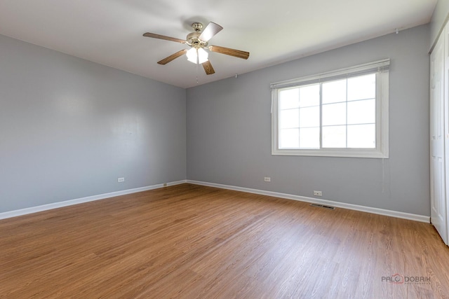 1680 Bicek Dr, Hoffman Estates, IL 60192 - empty room with light wood-style floors and a ceiling fan