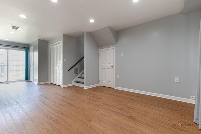 1680 Bicek Dr, Hoffman Estates, IL 60192 - empty room with light wood finished floors, stairs, and recessed lighting