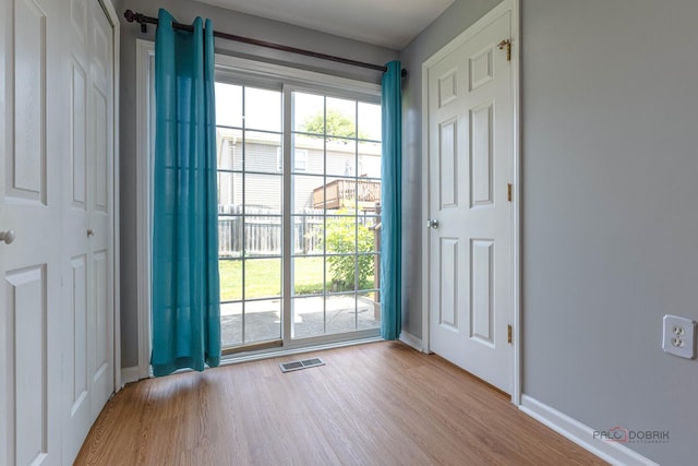 1680 Bicek Dr, Hoffman Estates, IL 60192 - doorway with wood finished floors and baseboards