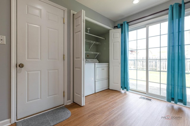 1680 Bicek Dr, Hoffman Estates, IL 60192 - washroom featuring washing machine and dryer and light wood-style floors