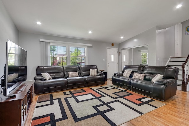 1680 Bicek Dr, Hoffman Estates, IL 60192 - living area with plenty of natural light, recessed lighting, wood finished floors, and lofted ceiling