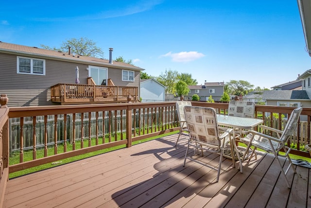 1680 Bicek Dr, Hoffman Estates, IL 60192 - deck featuring outdoor dining space and a residential view