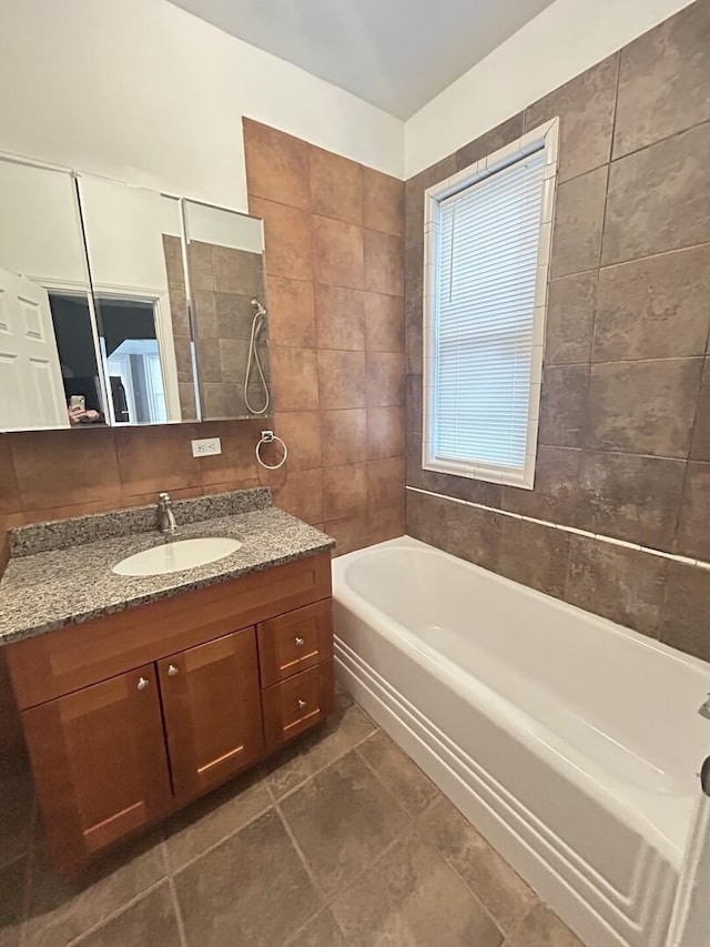 7038 S Vernon Ave, Chicago, IL 60637 - full bath featuring tile walls, a tub to relax in, vanity, a shower, and tile patterned floors