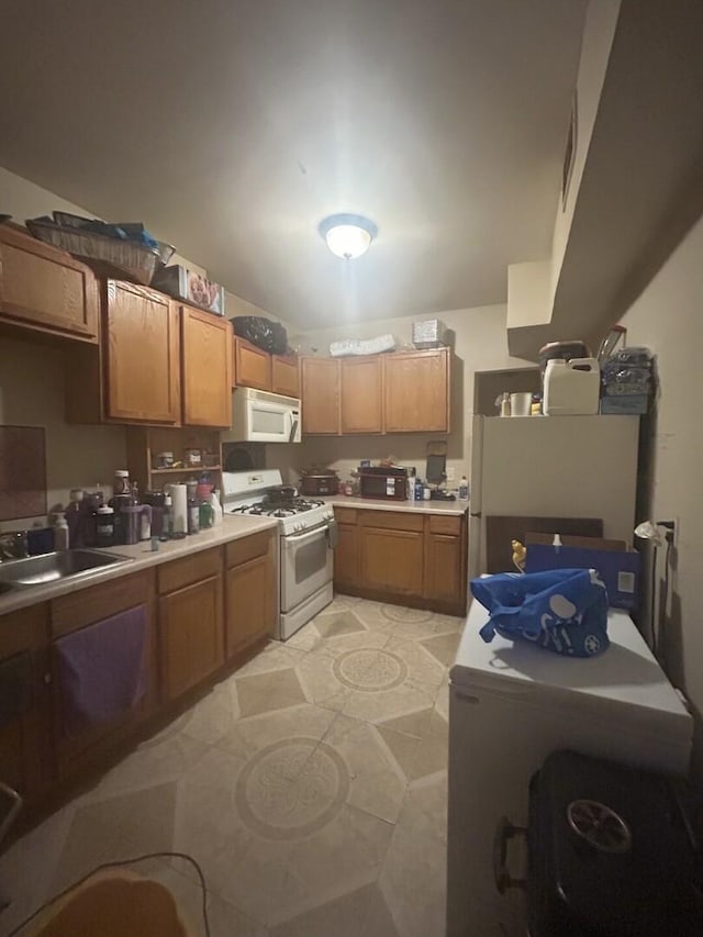 7038 S Vernon Ave, Chicago, IL 60637 - kitchen featuring white appliances, a sink, and brown cabinetry