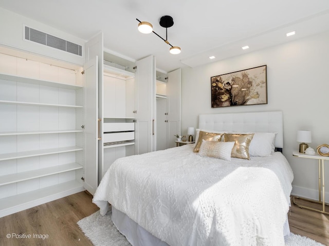 1310 N Ritchie Ct Unit 27B, Chicago, IL 60610 - bedroom with wood finished floors, recessed lighting, and baseboards
