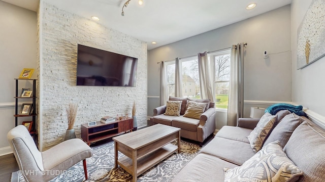 living area with wood finished floors and recessed lighting