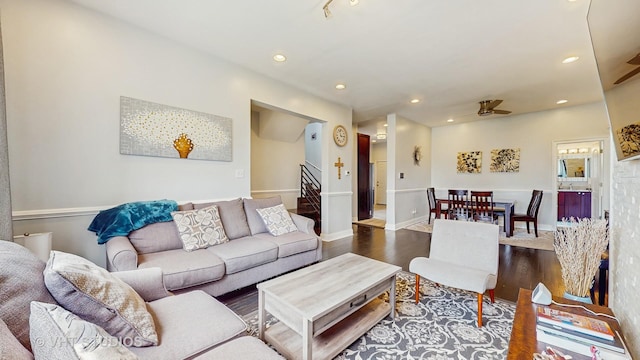 living area with wood finished floors, stairs, recessed lighting, a ceiling fan, and baseboards