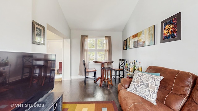 sitting room with lofted ceiling and wood finished floors