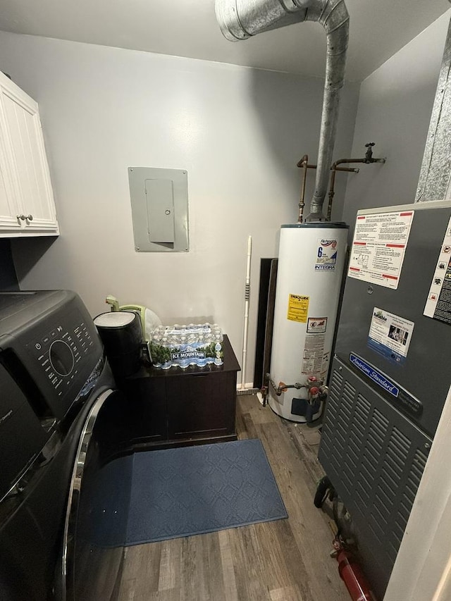 utility room featuring electric panel and gas water heater