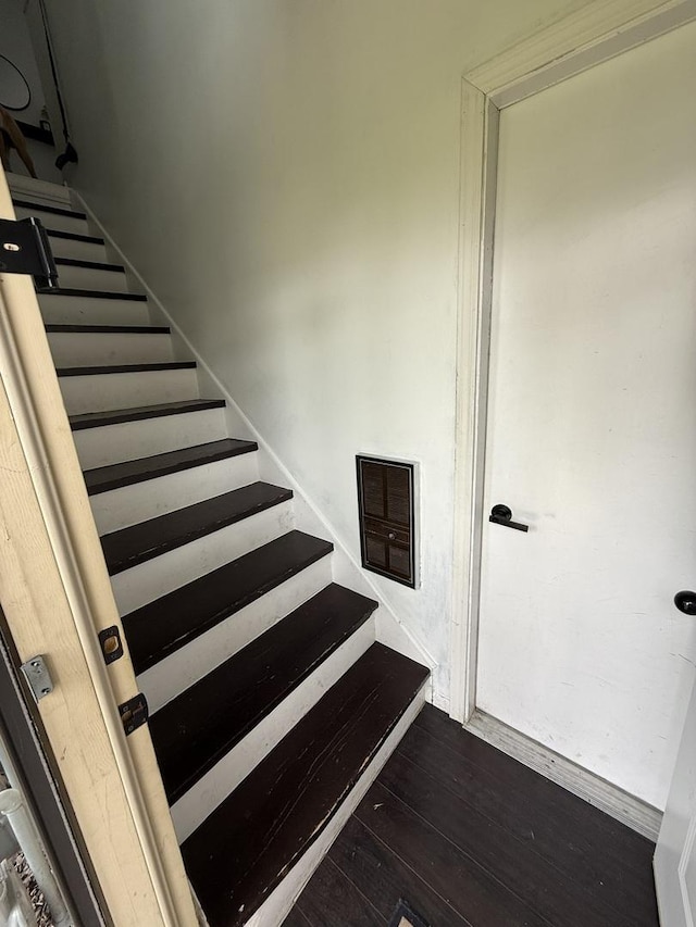 staircase featuring wood finished floors