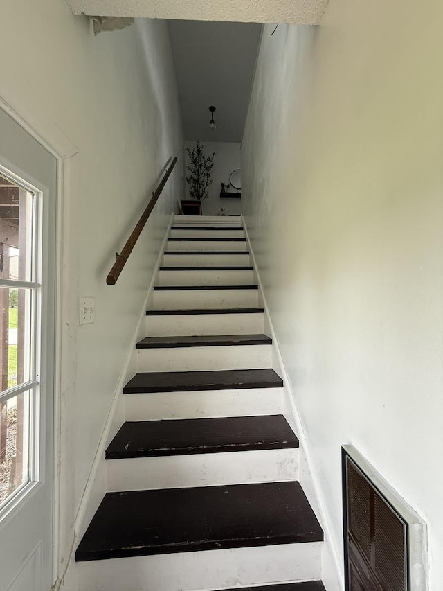 staircase featuring visible vents
