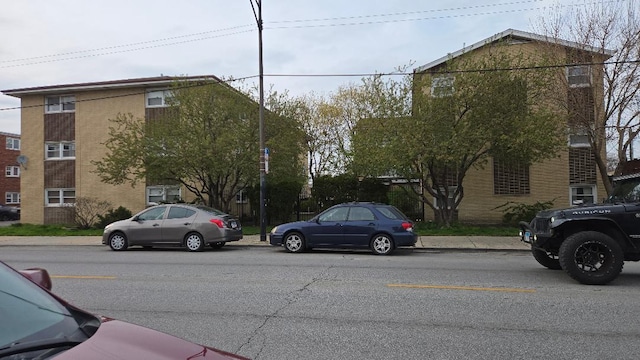 view of road with curbs and sidewalks