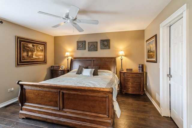 bedroom with baseboards, a ceiling fan, and dark wood-style floors