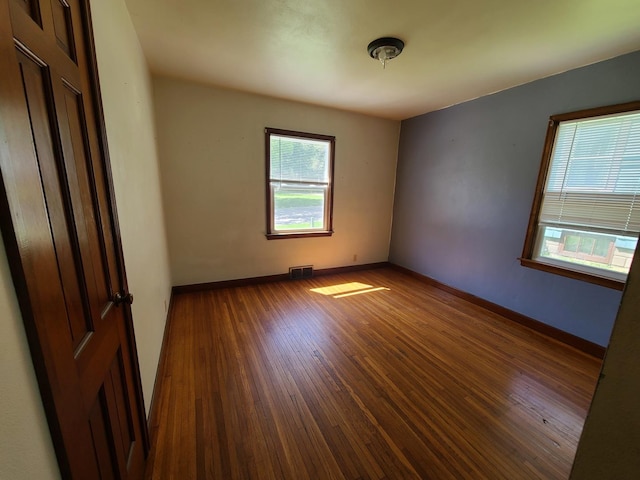 518 3rd Ave, Dixon, IL 61021 - spare room with wood finished floors and baseboards