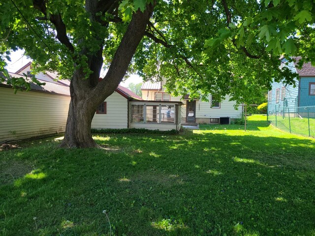 518 3rd Ave, Dixon, IL 61021 - view of yard featuring a sunroom
