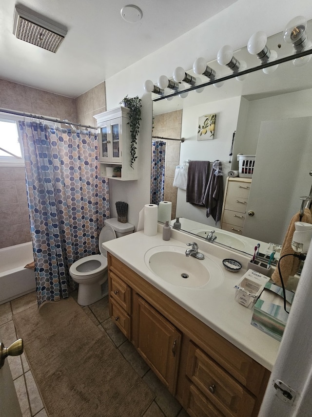 bathroom featuring a shower with curtain, visible vents, vanity, tile patterned floors, and toilet