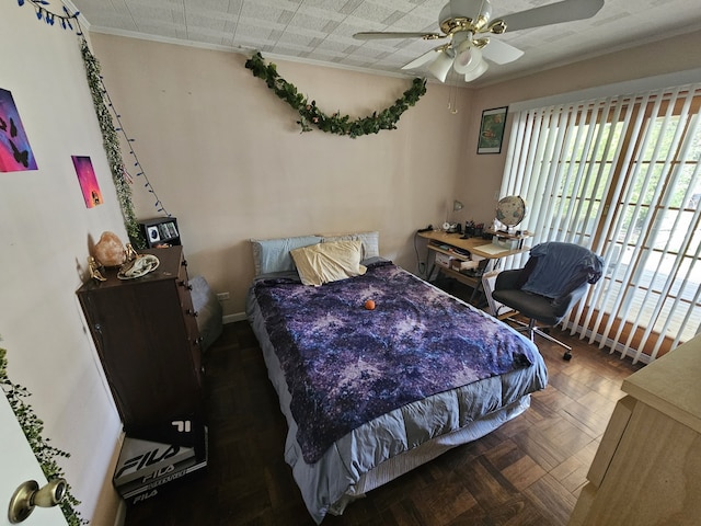 bedroom featuring crown molding and ceiling fan