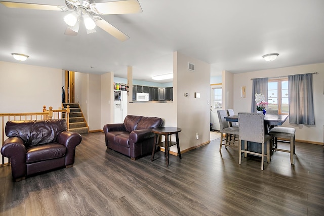 833 Poe St, Manteno, IL 60950 - living area with a ceiling fan, visible vents, dark wood-style floors, and stairway