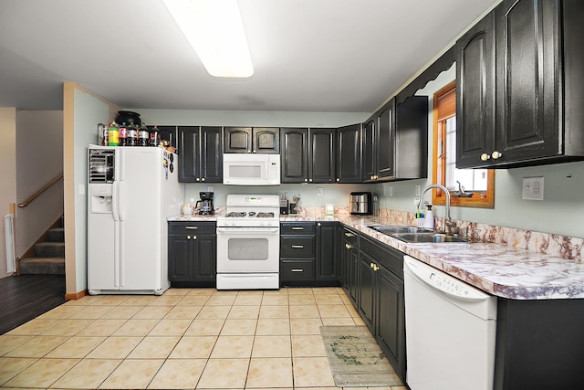 833 Poe St, Manteno, IL 60950 - kitchen with light tile patterned flooring, a sink, white appliances, and light countertops