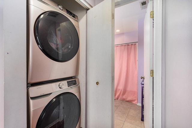 2743 River Bend Ln, Plainfield, IL 60586 - laundry room featuring stacked washer / drying machine and light tile patterned flooring