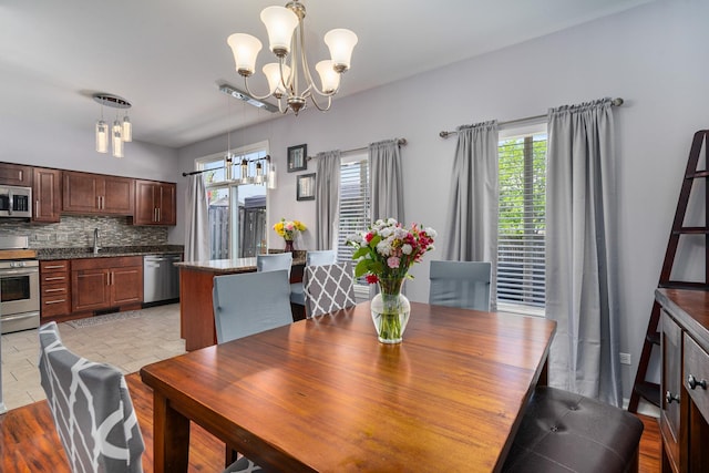 2743 River Bend Ln, Plainfield, IL 60586 - dining space with a chandelier and healthy amount of natural light