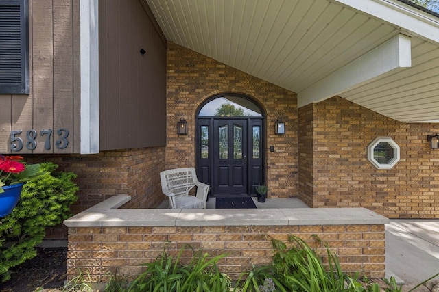 5873 Walnut Ave, Downers Grove, IL 60516 - doorway to property with brick siding and covered porch