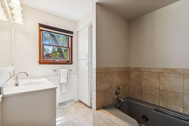 5873 Walnut Ave, Downers Grove, IL 60516 - full bathroom with vanity, a jetted tub, tile patterned flooring, and wainscoting