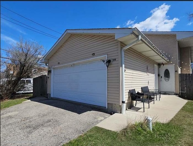 519 Greenwood Dr, Round Lake Park, IL 60073 - view of side of property featuring driveway and an attached garage