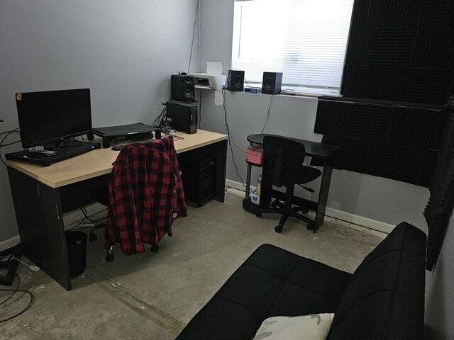 519 Greenwood Dr, Round Lake Park, IL 60073 - home office featuring unfinished concrete flooring and baseboards