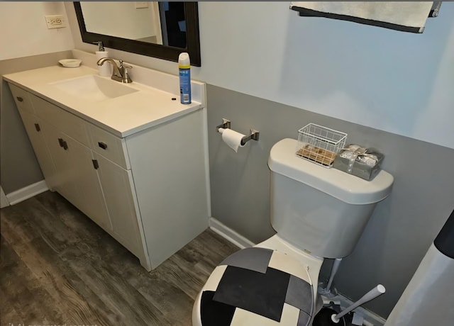 519 Greenwood Dr, Round Lake Park, IL 60073 - half bath featuring vanity, wood finished floors, toilet, and baseboards