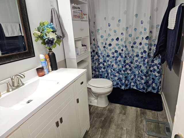 519 Greenwood Dr, Round Lake Park, IL 60073 - bathroom featuring wood finished floors, toilet, vanity, and curtained shower