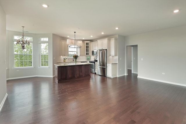 2701 Commons Dr Unit 409, Glenview, IL 60026 - kitchen featuring a chandelier, stainless steel appliances, baseboards, dark wood-style floors, and recessed lighting