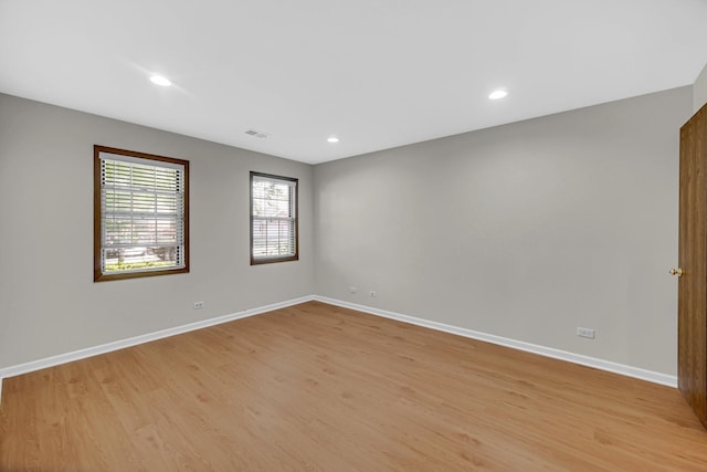 329 Pembroke Ct Unit 5, Schaumburg, IL 60193 - unfurnished room featuring light wood-style floors, baseboards, and recessed lighting