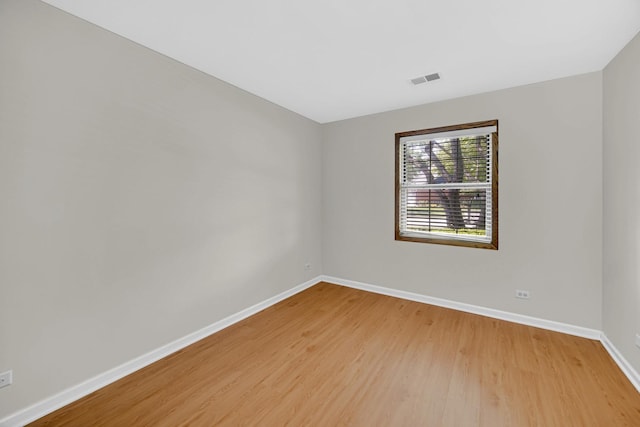 329 Pembroke Ct Unit 5, Schaumburg, IL 60193 - spare room featuring baseboards and light wood finished floors