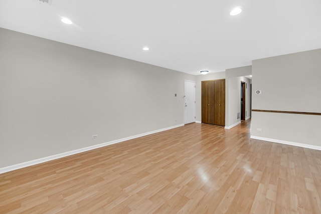 329 Pembroke Ct Unit 5, Schaumburg, IL 60193 - empty room with light wood finished floors, baseboards, and recessed lighting