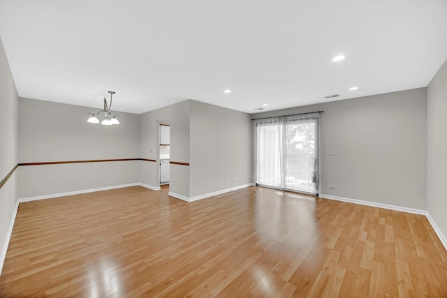 329 Pembroke Ct Unit 5, Schaumburg, IL 60193 - spare room featuring light wood finished floors, baseboards, a chandelier, and recessed lighting