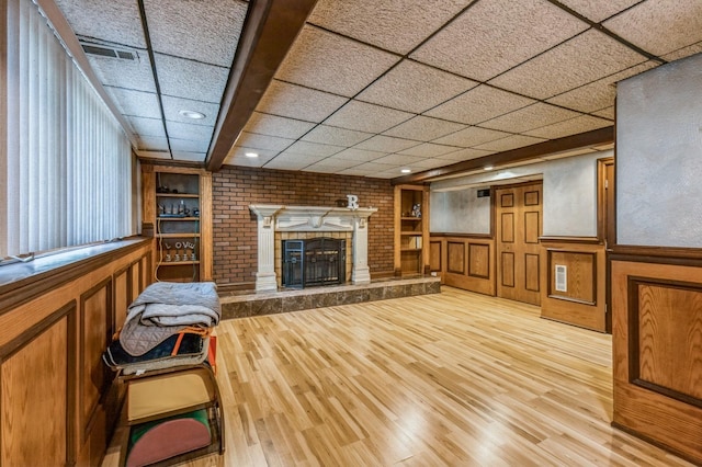 912 Macgregor Rd, Lockport, IL 60441 - living area with wood finished floors, a fireplace, recessed lighting, and a wainscoted wall