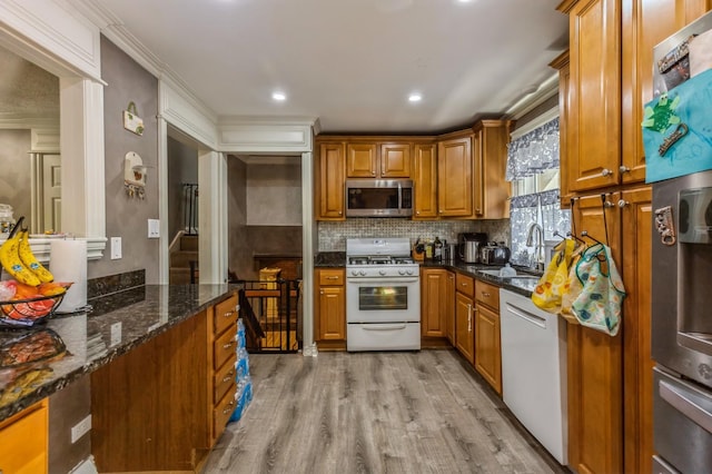 912 Macgregor Rd, Lockport, IL 60441 - kitchen featuring white appliances, a sink, brown cabinets, backsplash, and light wood finished floors