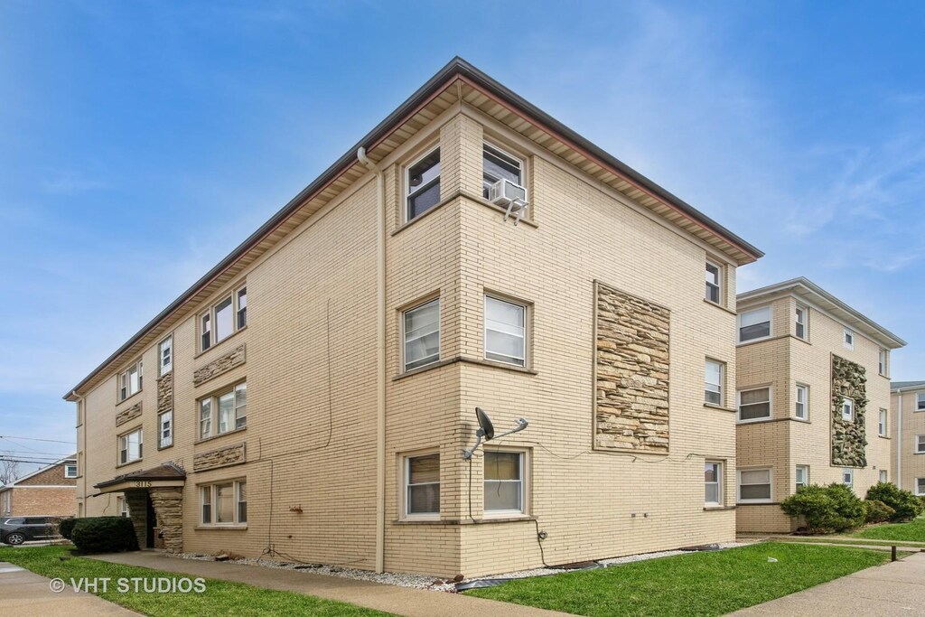 3115 N Nashville Ave Unit 2E, Chicago, IL 60634 - view of building exterior with cooling unit