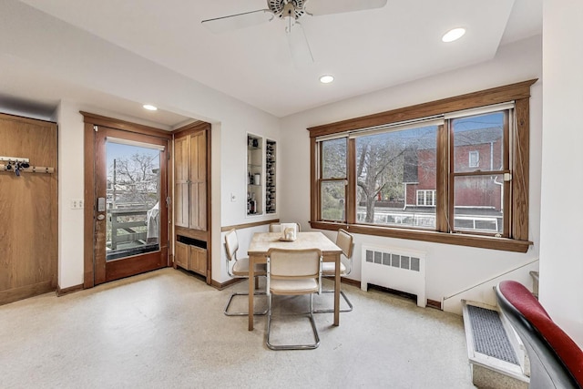 dining space featuring a ceiling fan, baseboards, recessed lighting, and radiator