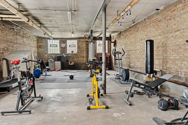 workout area with brick wall
