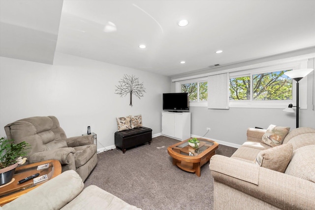carpeted living area featuring recessed lighting, baseboards, and visible vents