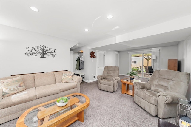 carpeted living area with recessed lighting and baseboards