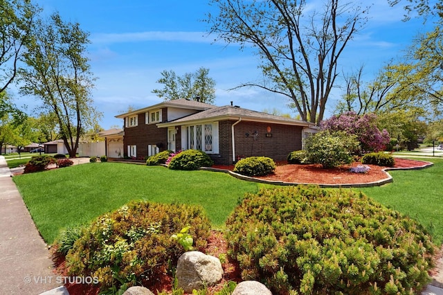 9125 W 144th Pl, Orland Park, IL 60462 - view of side of home with a garage, brick siding, and a lawn