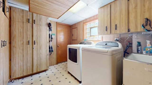 9125 W 144th Pl, Orland Park, IL 60462 - clothes washing area with cabinet space, light floors, and independent washer and dryer